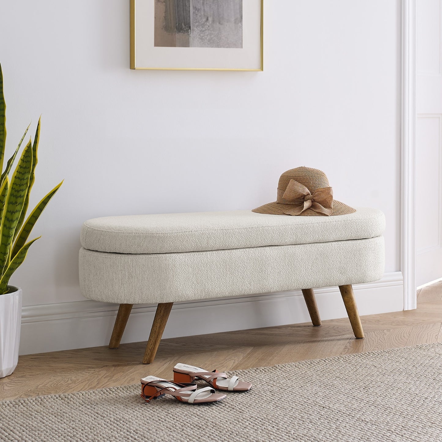 An elegant oval ottoman with hidden storage, crafted for timeless function and refined style